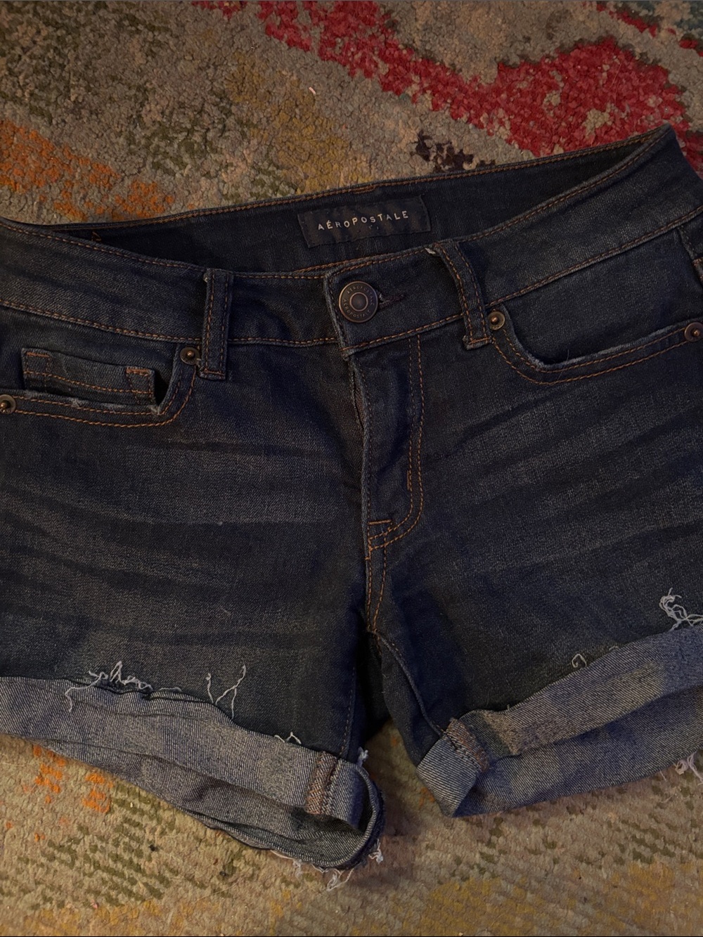 Aeropostale Navy Label on Blue Denim with Brown Stitching